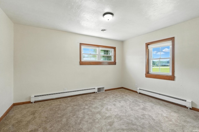 58 W Markle Rd, Huntington, IN 46750 - carpeted spare room with a baseboard heating unit