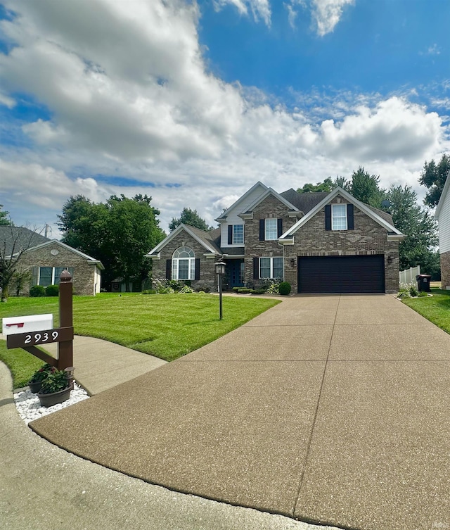 2939 Charlestown Ct, Evansville, IN 47725 - view of front of home with stone siding, a front yard, concrete driveway, and an attached garage