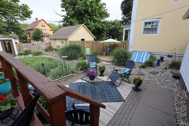 606 S S 10th St, Lafayette, IN 47905 - wooden deck featuring a patio, a fenced backyard, and an outdoor structure