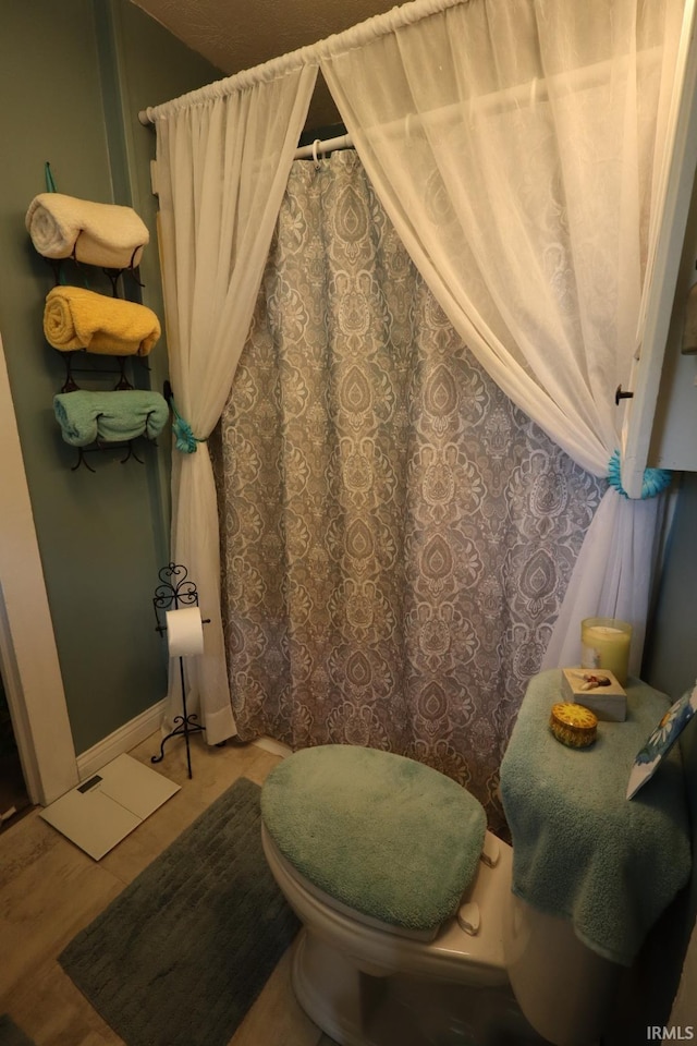 606 S S 10th St, Lafayette, IN 47905 - bathroom with wood finished floors and curtained shower