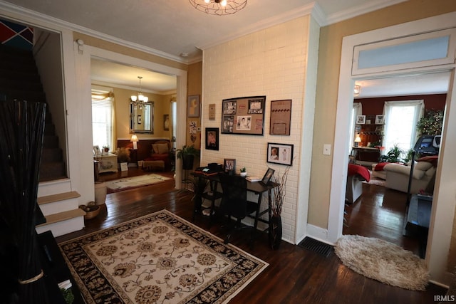 606 S S 10th St, Lafayette, IN 47905 - entrance foyer featuring wood finished floors, stairway, a chandelier, and ornamental molding