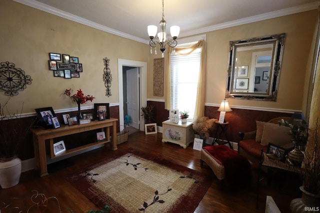 606 S S 10th St, Lafayette, IN 47905 - living area with a chandelier, wood finished floors, a wainscoted wall, and ornamental molding