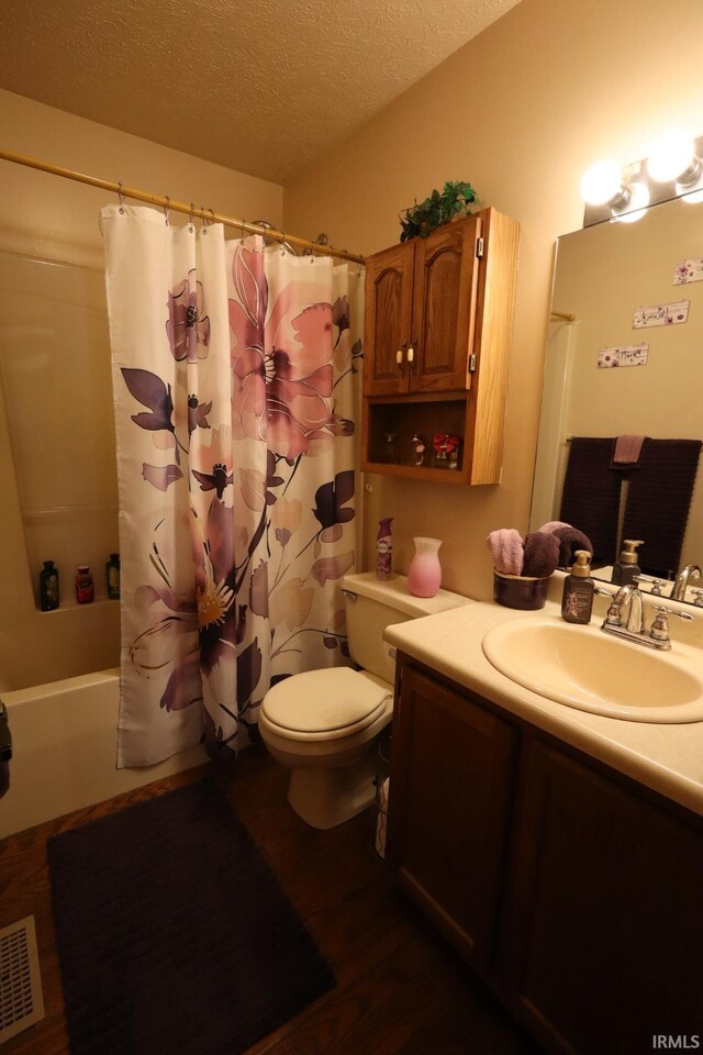 3718 George Washington Rd, Lafayette, IN 47909 - full bathroom featuring vanity, shower / bathtub combination with curtain, a textured ceiling, and wood finished floors