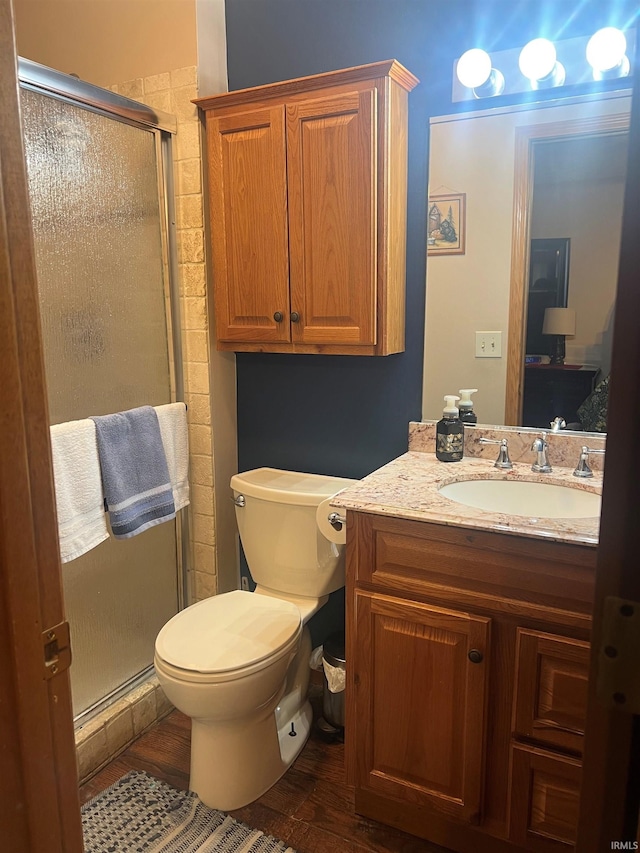 3718 George Washington Rd, Lafayette, IN 47909 - full bathroom with vanity, a shower stall, and wood finished floors