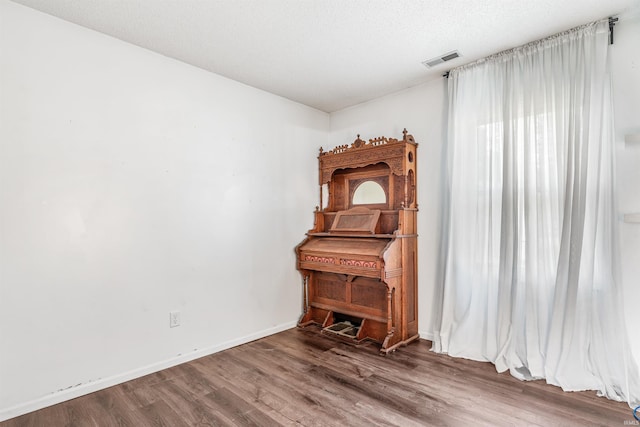 606 Larch Ln, Fort Wayne, IN 46825 - spare room featuring wood finished floors and baseboards