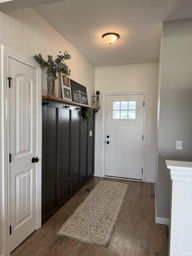 12788 Kingfish Ct, Middlebury, IN 46540 - entryway with wood finished floors and a textured ceiling
