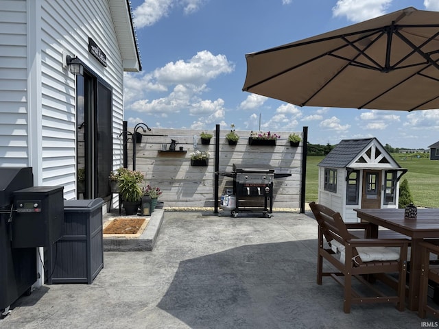12788 Kingfish Ct, Middlebury, IN 46540 - view of patio with outdoor dining area and a grill