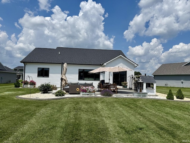 12788 Kingfish Ct, Middlebury, IN 46540 - back of property with an outdoor living space, a patio area, a yard, and roof with shingles