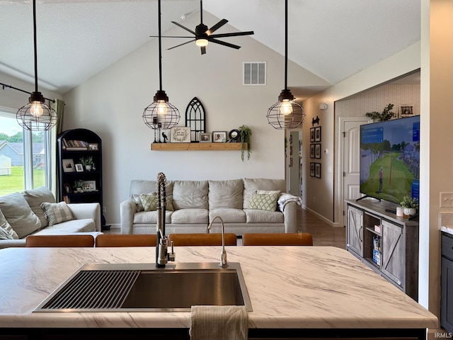 12788 Kingfish Ct, Middlebury, IN 46540 - living area with a ceiling fan, high vaulted ceiling, and wood finished floors