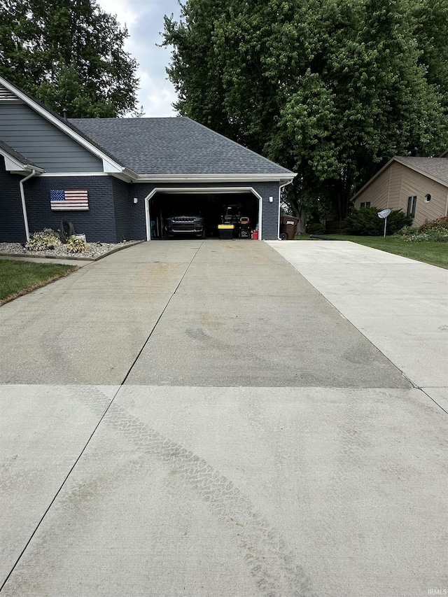 1701 Fairway Dr, Kokomo, IN 46901 - view of property exterior with driveway, a garage, and brick siding