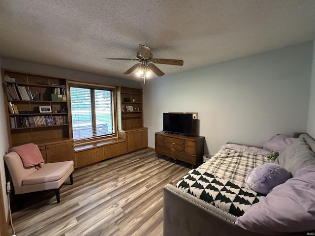 1701 Fairway Dr, Kokomo, IN 46901 - bedroom with wood finished floors, a textured ceiling, and ceiling fan