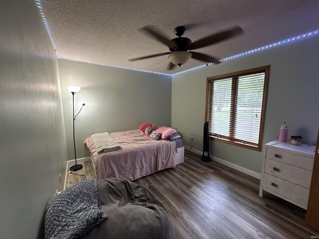 1701 Fairway Dr, Kokomo, IN 46901 - bedroom with a textured ceiling, wood finished floors, and a ceiling fan