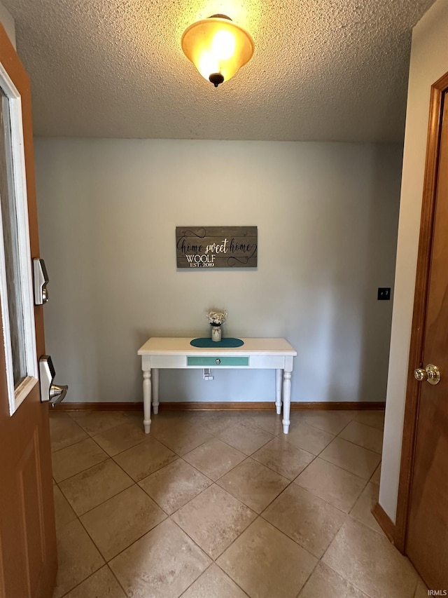 1701 Fairway Dr, Kokomo, IN 46901 - foyer with a textured ceiling and light tile patterned floors