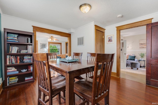 306 E Market St, Bluffton, IN 46714 - dining room with dark wood-style floors, crown molding, and a ceiling fan