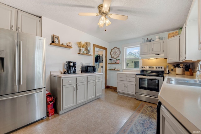 306 E Market St, Bluffton, IN 46714 - kitchen with appliances with stainless steel finishes, open shelves, under cabinet range hood, a textured ceiling, and light countertops
