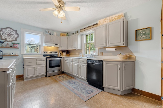 306 E Market St, Bluffton, IN 46714 - kitchen with stainless steel range with electric stovetop, dishwasher, under cabinet range hood, light countertops, and a textured ceiling