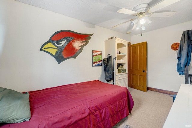 306 E Market St, Bluffton, IN 46714 - carpeted bedroom with a ceiling fan and baseboards