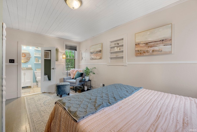 306 E Market St, Bluffton, IN 46714 - bedroom with hardwood / wood-style floors, connected bathroom, and wood ceiling