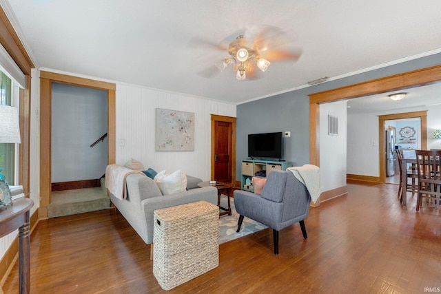 306 E Market St, Bluffton, IN 46714 - living area with a ceiling fan, crown molding, wood finished floors, and stairs