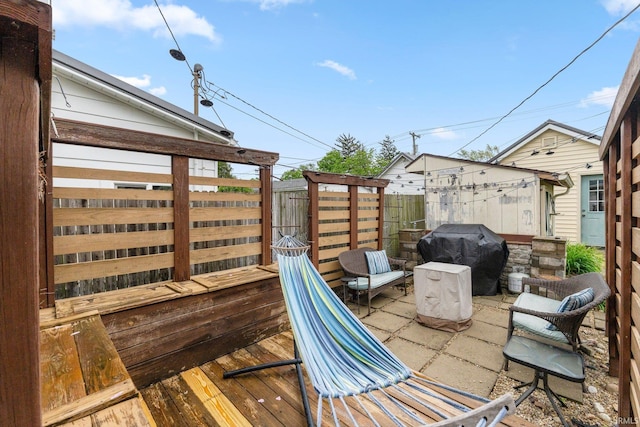 306 E Market St, Bluffton, IN 46714 - wooden deck featuring a grill and a patio area
