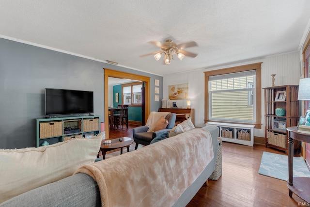 306 E Market St, Bluffton, IN 46714 - living room featuring ornamental molding, a ceiling fan, wood finished floors, and a textured ceiling