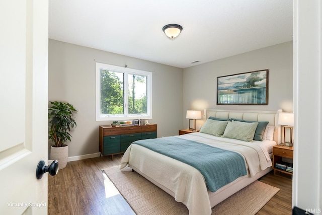 16807 Darling Rd, Woodburn, IN 46797 - bedroom with wood finished floors and baseboards