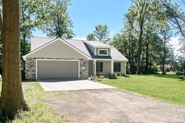16807 Darling Rd, Woodburn, IN 46797 - view of front of property featuring driveway, an attached garage, a front lawn, and a shingled roof