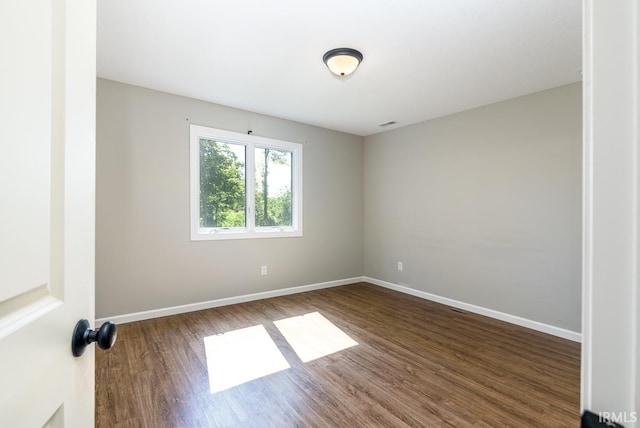 16807 Darling Rd, Woodburn, IN 46797 - empty room with wood finished floors and baseboards