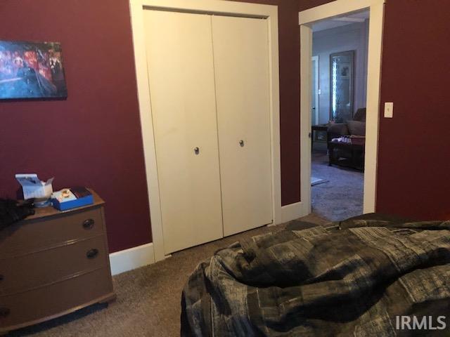 1124 N Maple St, Richland, IN 47634 - bedroom featuring carpet flooring and a closet