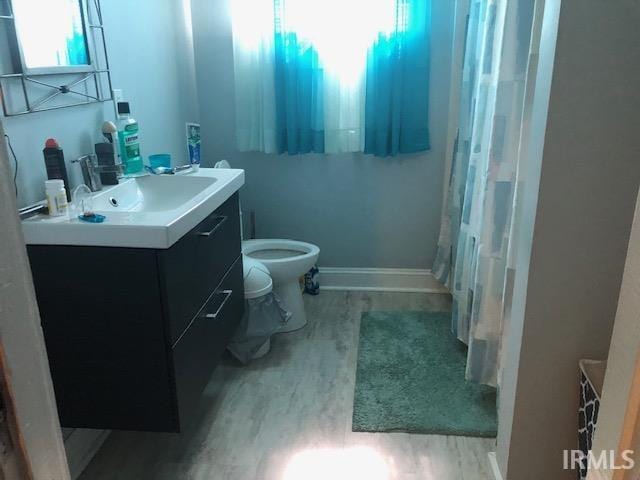 1124 N Maple St, Richland, IN 47634 - bathroom featuring wood finished floors and vanity