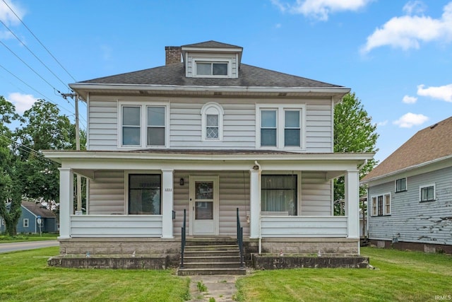 1234 Summit St, New Haven, IN 46774 - american foursquare style home with covered porch, a front yard, and a shingled roof