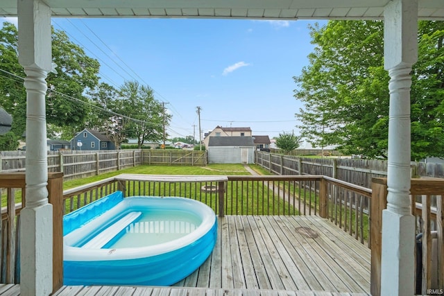 1234 Summit St, New Haven, IN 46774 - wooden terrace featuring a fenced backyard and a storage unit