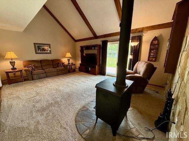 9910 Quachita Ct, Fort Wayne, IN 46804 - carpeted living room with beamed ceiling and high vaulted ceiling