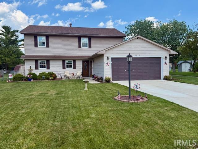 9910 Quachita Ct, Fort Wayne, IN 46804 - view of front of home featuring a garage and driveway