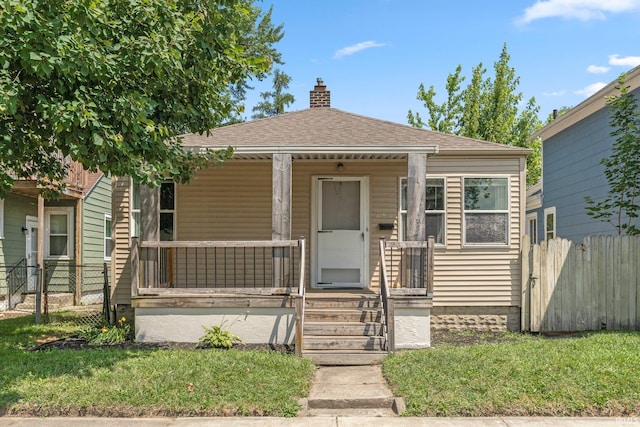638 W 4th St, Fort Wayne, IN 46808 - bungalow-style home featuring a chimney, a porch, and a shingled roof