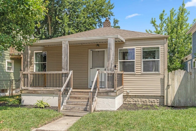 638 W 4th St, Fort Wayne, IN 46808 - bungalow featuring a chimney, a shingled roof, and a porch