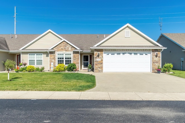 1709 Krebs Ct, Angola, IN 46703 - view of front of property featuring stone siding, an attached garage, driveway, and a front yard