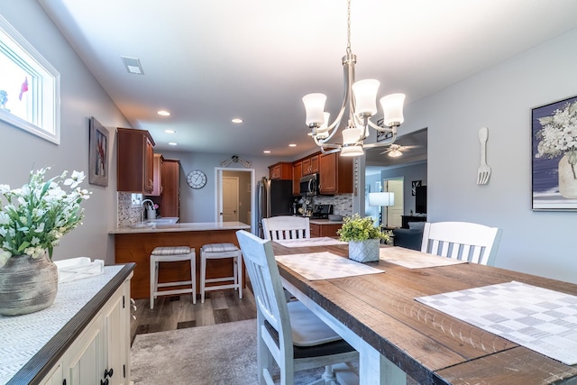 1709 Krebs Ct, Angola, IN 46703 - dining area featuring a chandelier, wood finished floors, recessed lighting, and ceiling fan