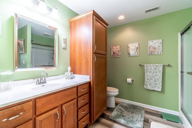 1709 Krebs Ct, Angola, IN 46703 - full bath featuring wood finished floors, vanity, a shower with door, and recessed lighting
