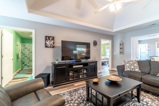1709 Krebs Ct, Angola, IN 46703 - living area featuring light wood-style flooring, ceiling fan, and a raised ceiling