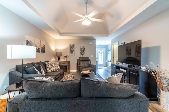 1709 Krebs Ct, Angola, IN 46703 - living room with wood finished floors, a raised ceiling, and a ceiling fan