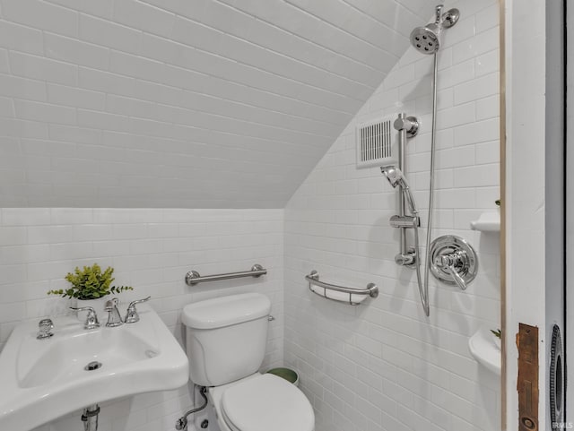 1337 W Wayne St, Fort Wayne, IN 46802 - bathroom featuring lofted ceiling and tile walls