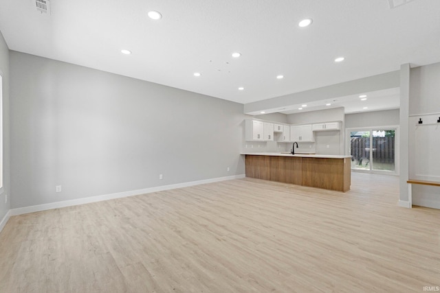 5960/62/64/66 N Clinton St, Fort Wayne, IN 46825 - unfurnished living room with light wood-style floors and recessed lighting