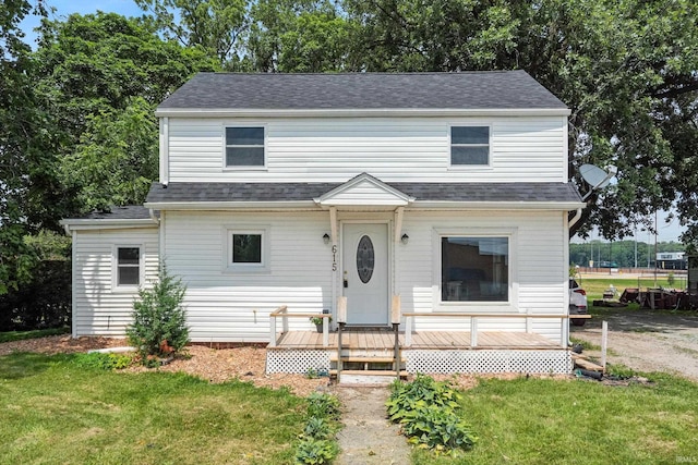 615 E Main St, Butler, IN 46721 - view of front of home featuring a front lawn, a wooden deck, and a shingled roof