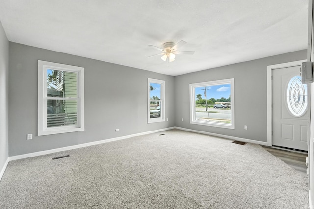 615 E Main St, Butler, IN 46721 - foyer entrance with ceiling fan and carpet flooring