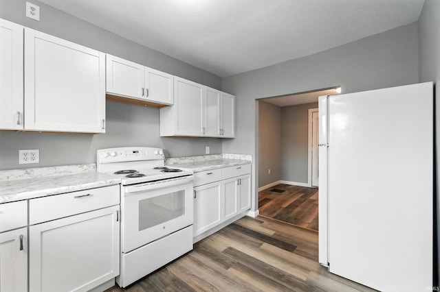 615 E Main St, Butler, IN 46721 - kitchen with white appliances, light countertops, white cabinets, and wood finished floors
