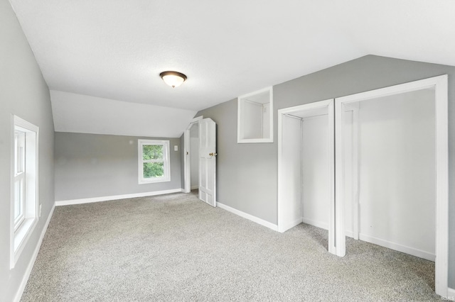 615 E Main St, Butler, IN 46721 - unfurnished bedroom with lofted ceiling and carpet
