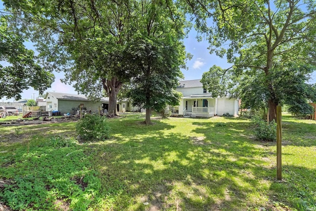 615 E Main St, Butler, IN 46721 - view of green lawn featuring covered porch