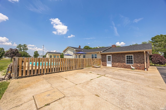 1827 N State Road 257, Otwell, IN 47564 - rear view of property featuring brick siding and a patio