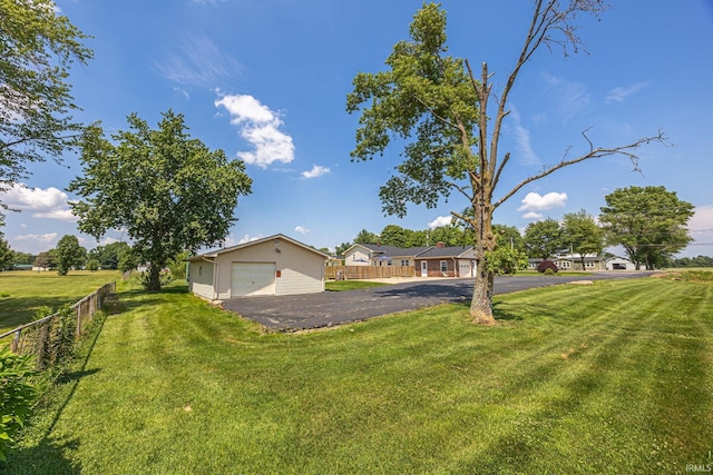 1827 N State Road 257, Otwell, IN 47564 - view of front of property with a detached garage, an outbuilding, and driveway